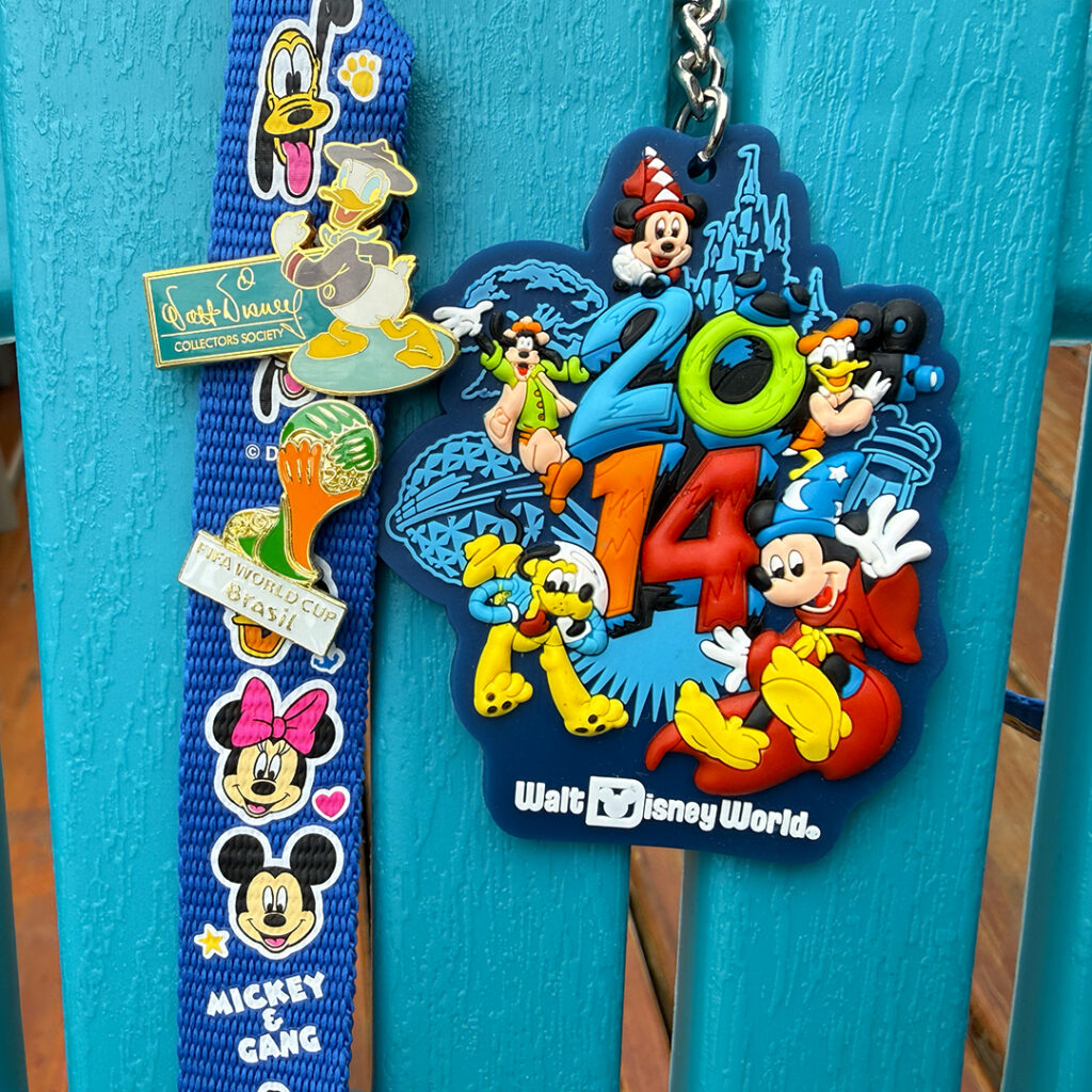 Walt Disney World 2014 World Cup souvenir showing a Mickey Mouse keychain alongside a lanyard with a FIFA World Cup pin.