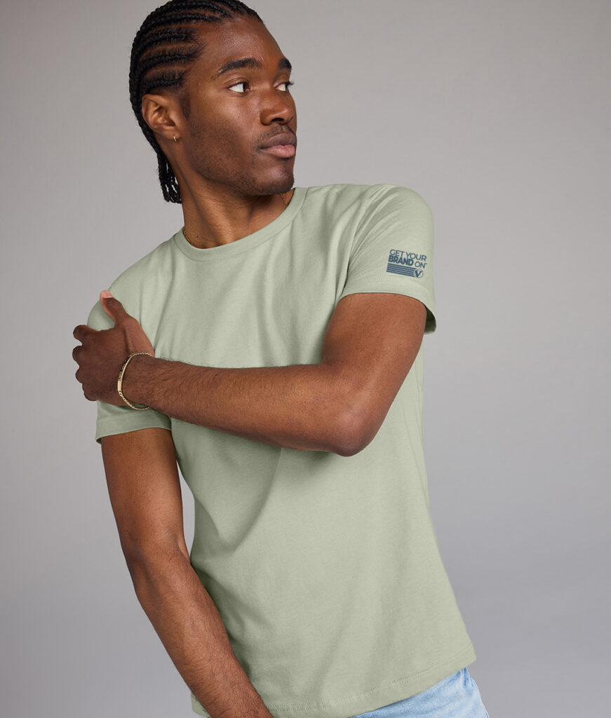 Model wearing a branded t-shirt with a logo printed on the sleeve, highlighting custom apparel for schools, colleges, and educational institutions.