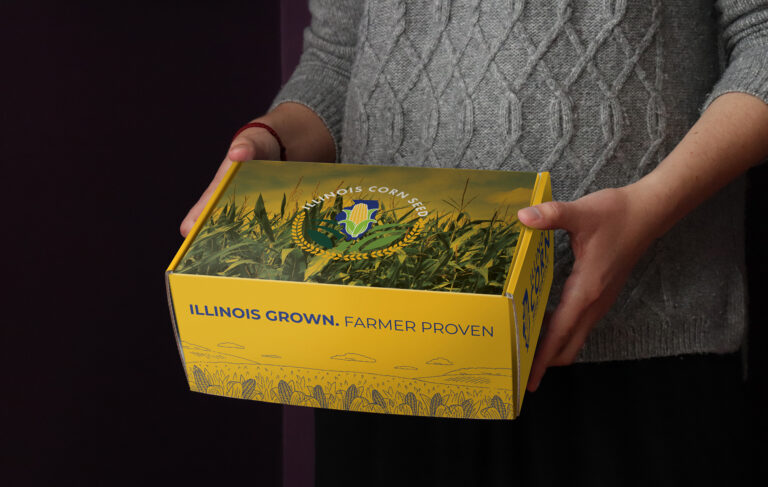 Custom-branded corrugated mailer box with full-color agricultural graphics and logo printing, demonstrating custom packaging designed to reinforce brand identity and product presentation.