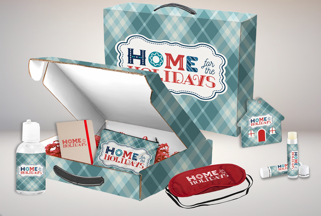 Custom branded merchandise gift set featuring a printed mailer box, shopping bag, notebook, hand sanitizer, lip balm, luggage tag, sleep mask, and other coordinated promotional items in a blue plaid design.